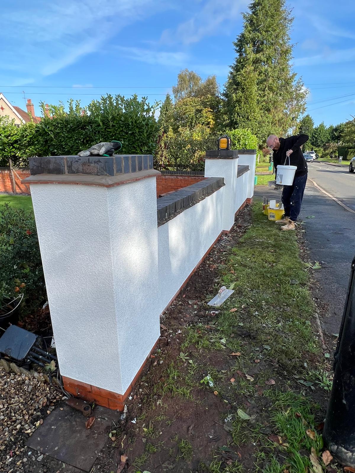 After: rendered garden wall with brick piers and brick copings